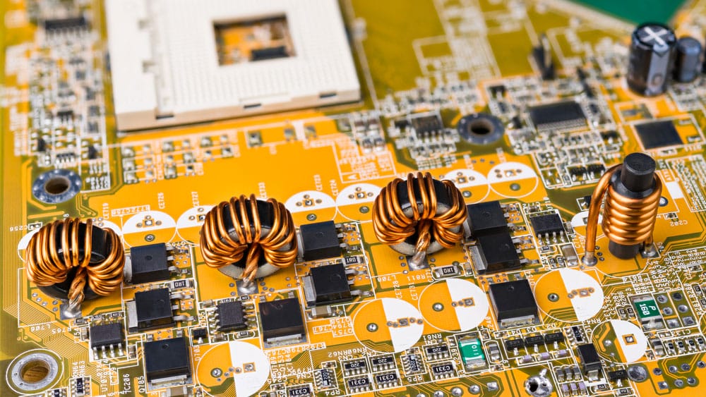 four inductors with ferromagnetic core on circuit board